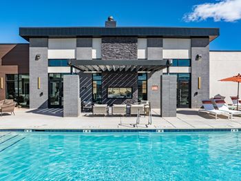 Clubhouse exterior and pool in front 